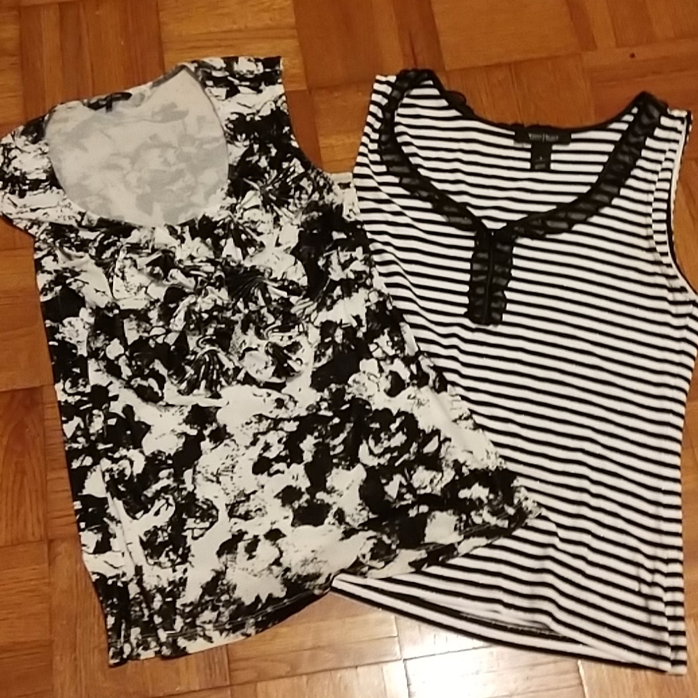 2 blacks and white sleeveless tops.